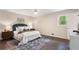 Cozy bedroom features a ceiling fan and a large window for ample natural light at 3131 Garden Lane Dr, Marietta, GA 30062
