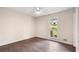 Bright bedroom features hardwood floors, neutral walls, ceiling fan and a sun-filled window view at 3131 Garden Lane Dr, Marietta, GA 30062