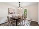 Cozy dining room with a dark wood table, modern chandelier and geometric rug at 3131 Garden Lane Dr, Marietta, GA 30062