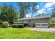 Charming exterior features a deck, well-maintained yard, and three car garage at 3131 Garden Lane Dr, Marietta, GA 30062