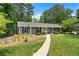 Cozy home with a tidy front lawn and a welcoming walkway at 3131 Garden Lane Dr, Marietta, GA 30062