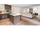 Modern kitchen boasts stainless appliances and island and opens to bright living room at 3131 Garden Lane Dr, Marietta, GA 30062