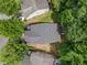 Aerial view of the house showing the backyard, trees, and roof at 930 Silver Lake Dr, Acworth, GA 30102