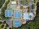 Aerial view of community amenities including tennis courts, basketball court, swimming pool and clubhouse at 930 Silver Lake Dr, Acworth, GA 30102