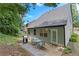 Back exterior view with a patio, grill, and a table and chairs at 930 Silver Lake Dr, Acworth, GA 30102