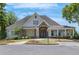 Charming clubhouse exterior with stone accents, manicured landscaping, and welcoming entrance at 930 Silver Lake Dr, Acworth, GA 30102