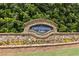 Stone entrance sign for Centennial Lakes community, showcasing landscaping and a welcoming atmosphere at 930 Silver Lake Dr, Acworth, GA 30102