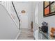 Inviting entryway with a staircase, light wood floors, and a view of the front door at 930 Silver Lake Dr, Acworth, GA 30102