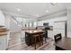 Open-concept kitchen with an island, stainless steel appliances, and view of the adjacent living space at 930 Silver Lake Dr, Acworth, GA 30102