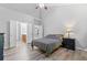 Bright main bedroom with an ensuite bathroom, hardwood floors, and a vaulted ceiling at 930 Silver Lake Dr, Acworth, GA 30102