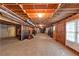 Unfinished basement, framed, with exposed ceiling, and window with natural light at 11575 Wildwood Springs Dr, Roswell, GA 30075
