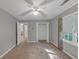 Cozy bedroom features neutral paint, carpet, window, and closet at 11575 Wildwood Springs Dr, Roswell, GA 30075