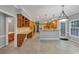 Spacious open kitchen featuring stainless steel appliances, granite countertops and breakfast bar at 11575 Wildwood Springs Dr, Roswell, GA 30075
