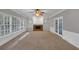 Spacious living room with fireplace, built-ins, and bright windows at 11575 Wildwood Springs Dr, Roswell, GA 30075