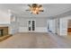 Living room featuring a fireplace, built-ins, and view to the kitchen at 11575 Wildwood Springs Dr, Roswell, GA 30075