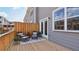 Cozy wooden deck with patio seating, privacy fence and glass door access to the home's interior at 208 College Cir # 1008, Hapeville, GA 30354