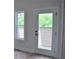 Balcony access through glass doors and window with a view of trees at 293 White St # 2, Marietta, GA 30060