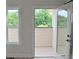 View of balcony with trees through glass doors and a window at 293 White St # 2, Marietta, GA 30060