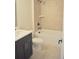 Bathroom with tile flooring, granite vanity, white toilet, and tiled shower at 293 White St # 2, Marietta, GA 30060