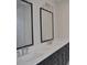 Double vanity bathroom featuring square mirrors, white countertops, and dark cabinets at 293 White St # 2, Marietta, GA 30060