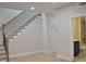 Entryway with staircase and bathroom featuring granite countertop and black cabinets at 293 White St # 2, Marietta, GA 30060