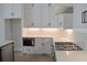 Modern kitchen with white cabinetry, stainless steel appliances, and subway tile backsplash at 293 White St # 2, Marietta, GA 30060