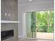 Living room with modern fireplace and sliding glass doors to deck with natural views at 293 White St # 2, Marietta, GA 30060