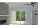 Bright living room with modern fireplace and sliding glass doors to deck with natural views at 293 White St # 2, Marietta, GA 30060