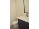 Powder room with modern black hardware and white vanity at 293 White St # 2, Marietta, GA 30060