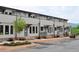View of newly built townhomes with landscaped yards and covered entrances enhancing curb appeal at 293 White St # 2, Marietta, GA 30060