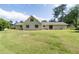 Expansive backyard with a well-maintained lawn and a view of the house's exterior at 297 Northgate Trce, Roswell, GA 30075