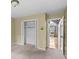 Bedroom with neutral walls and carpet, closet, and view of the living room at 297 Northgate Trce, Roswell, GA 30075