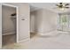 Bedroom boasts a ceiling fan, carpeted floor, and a closet for organized storage at 297 Northgate Trce, Roswell, GA 30075