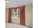 Bedroom with carpet and neutral walls and a window with red and tan plaid curtains at 297 Northgate Trce, Roswell, GA 30075