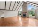 Spacious living room with vaulted ceiling, wood beams, fireplace and gleaming hardwood floors at 297 Northgate Trce, Roswell, GA 30075