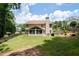 Large, level backyard features a screened porch and mature landscaping at 516 Huntgate Rd, Woodstock, GA 30189