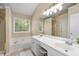 Bright bathroom suite with double vanity sinks, garden tub, and a glass-enclosed shower at 516 Huntgate Rd, Woodstock, GA 30189
