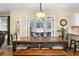 Dining area has wood floors, a wooden dining table and chairs and french doors to outside at 516 Huntgate Rd, Woodstock, GA 30189