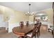 Dining room featuring a wooden table, with decor looking into the kitchen at 516 Huntgate Rd, Woodstock, GA 30189