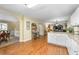 Spacious kitchen featuring white cabinets and granite countertops, open to the dining and living spaces at 516 Huntgate Rd, Woodstock, GA 30189