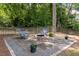 Paver patio with fire pit perfect for outdoor entertaining at 516 Huntgate Rd, Woodstock, GA 30189