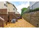 Private backyard with deck, stone landscaping, and fenced perimeter at 1304 Liberty Nw Pkwy # 1610, Atlanta, GA 30318