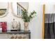 Stylish bar area with mirrored accents, glassware, decorative items, and a bar cart at 1304 Liberty Nw Pkwy # 1610, Atlanta, GA 30318