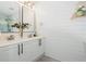 Elegant bathroom featuring a dual sink vanity, shiplap walls, and stylish mirrors at 1304 Liberty Nw Pkwy # 1610, Atlanta, GA 30318