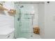 Modern bathroom with glass shower, white subway tiles, wooden shelves, and hexagon floor tiles, offering a spa-like experience at 1304 Liberty Nw Pkwy # 1610, Atlanta, GA 30318
