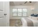 Bedroom featuring a large window, neutral tones and carpeted floors at 1304 Liberty Nw Pkwy # 1610, Atlanta, GA 30318