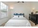 Bright bedroom with a large window, wood-accent wall, stylish decor, and lots of natural light at 1304 Liberty Nw Pkwy # 1610, Atlanta, GA 30318