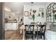 Bright dining area featuring built-in bench seating, stylish decor, and open access to the modern kitchen and living spaces at 1304 Liberty Nw Pkwy # 1610, Atlanta, GA 30318
