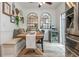 Beautiful dining area featuring built-in bench seating, large windows, and stainless steel refrigerator with a wine cooler at 1304 Liberty Nw Pkwy # 1610, Atlanta, GA 30318