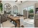 Cozy dining area with built-in bench, direct access to a patio, and stainless steel refrigerator and appliances at 1304 Liberty Nw Pkwy # 1610, Atlanta, GA 30318